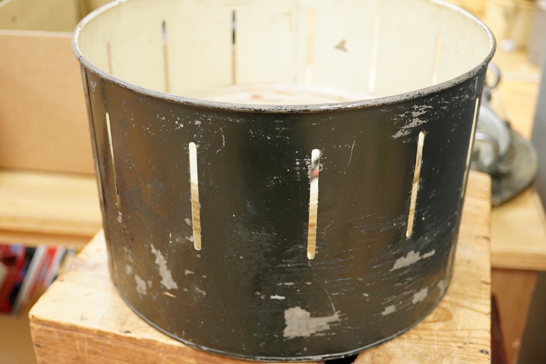 A late 19th century painted tin and mahogany zoetrope by the London Stereoscopic Co. with a number of paper inserts, diameter 30cm